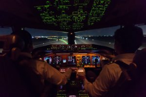 Inside cockpit of commercial airplane after just landed on the runway. Modern aviation concept.